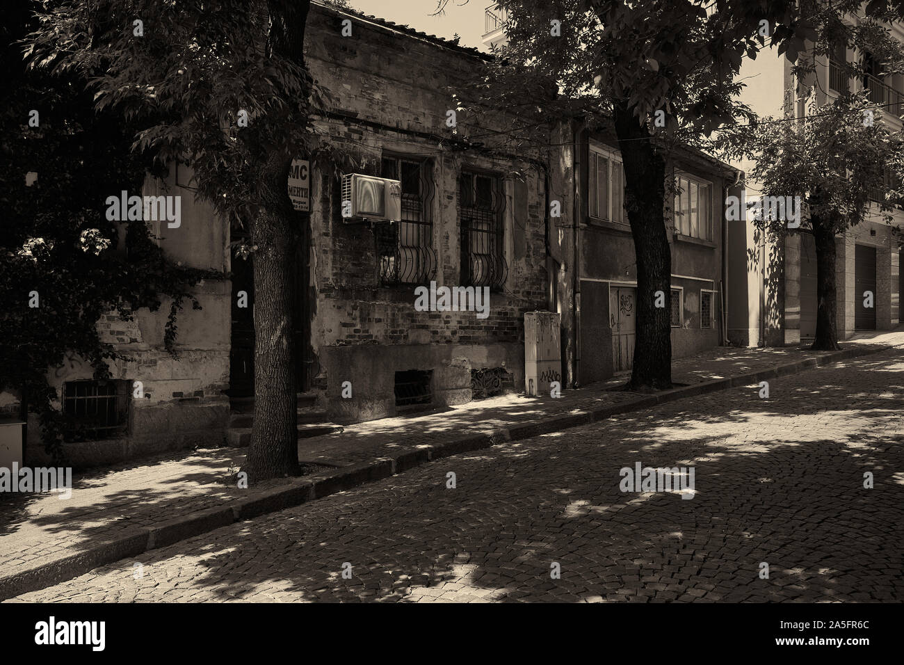 PLOVDIV, BULGARIA - JULY 02, 2019: One of the streets in the old city. Plovdiv is the second largest city in Bulgaria. Vintage toning. Sepia. Stock Photo