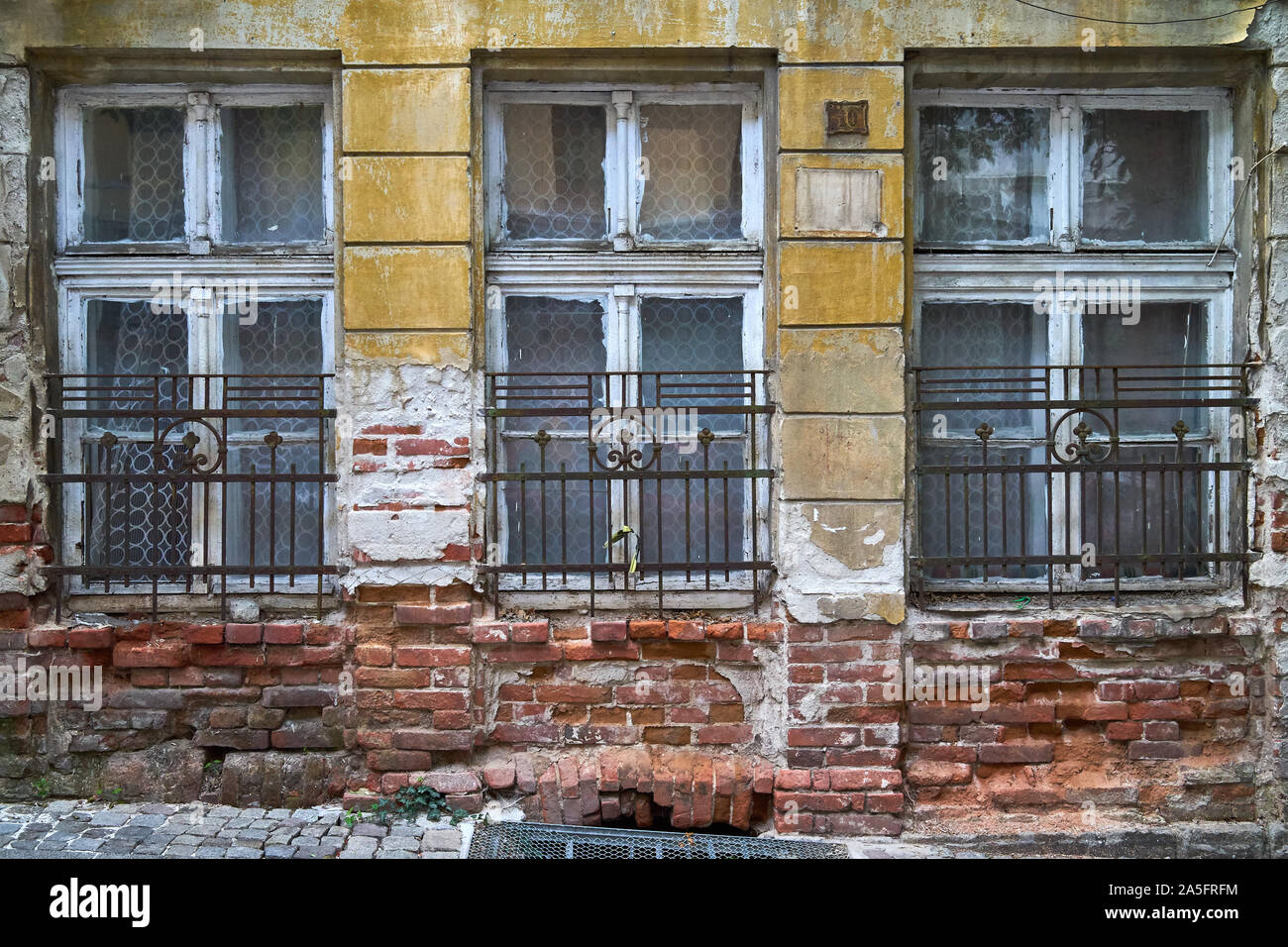 Fragment of the facade of an abandoned building Stock Photo - Alamy