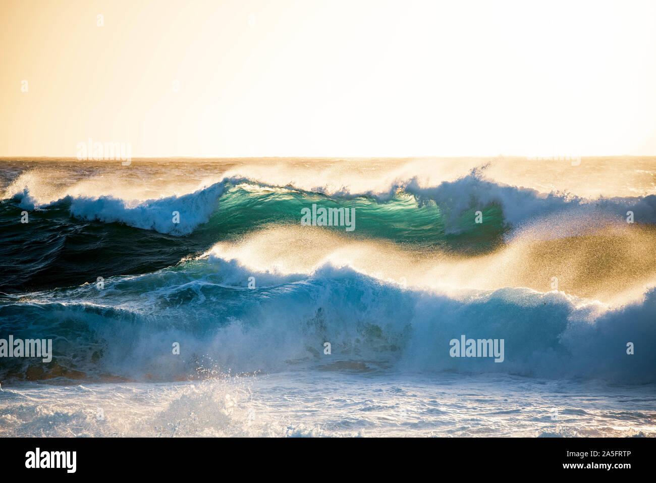 Waves breaking on beach hi-res stock photography and images - Alamy