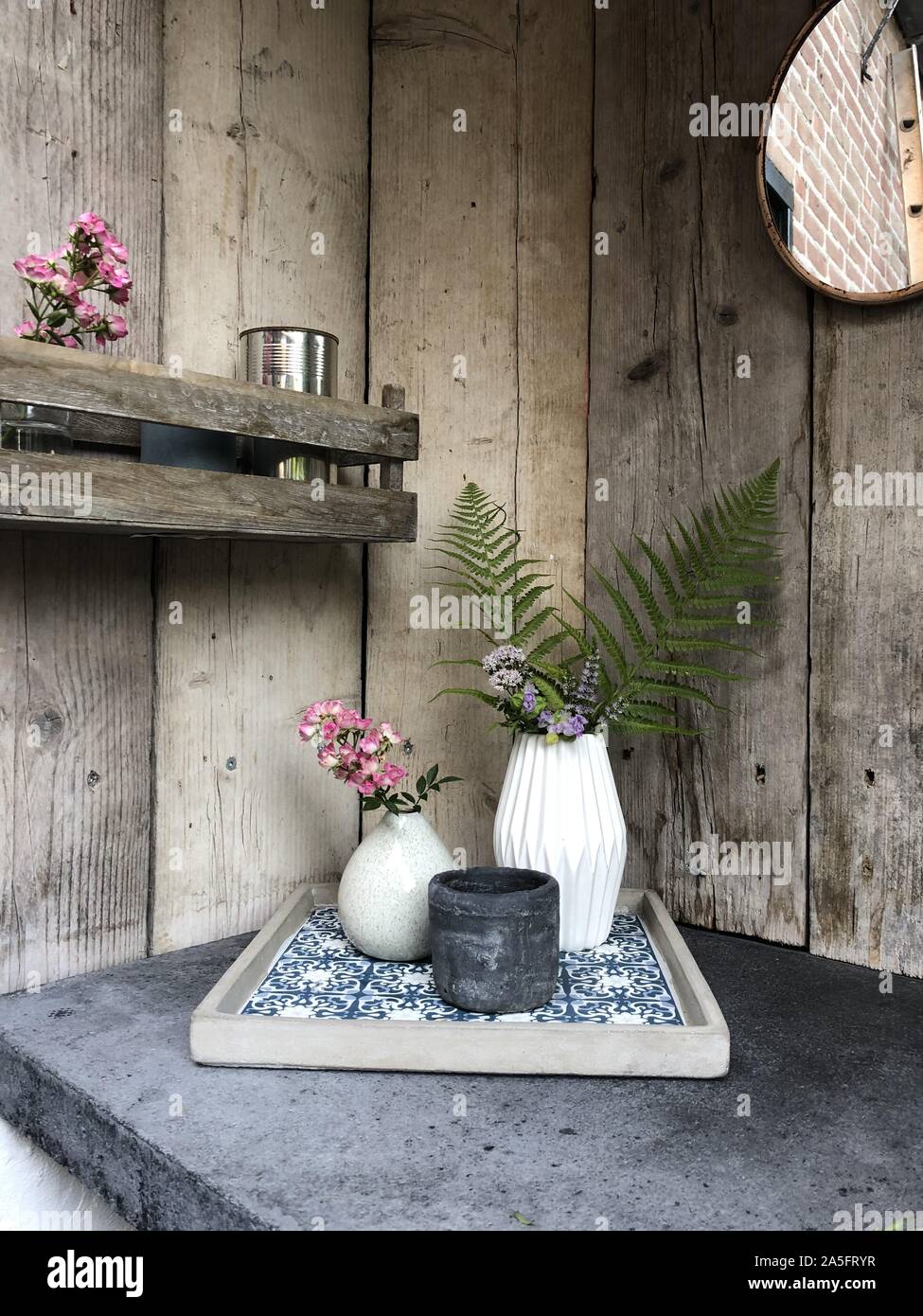 Flower arrangements in an outdoor kitchen Stock Photo