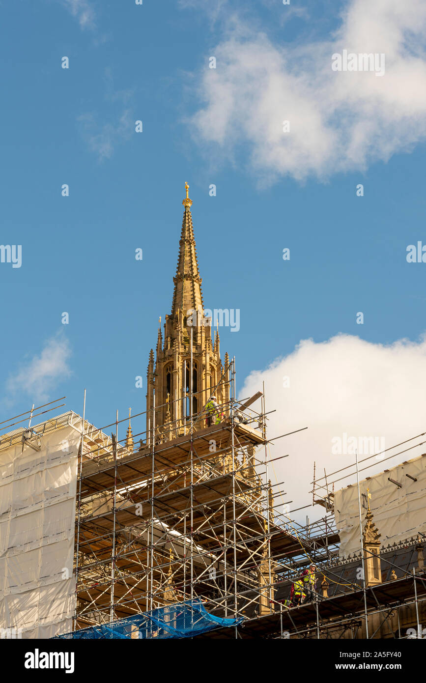 Spire of Palace of Westminster under restoration with scaffolding and workmen. Workers on scaffold platform. Houses of Parliament repairs Stock Photo