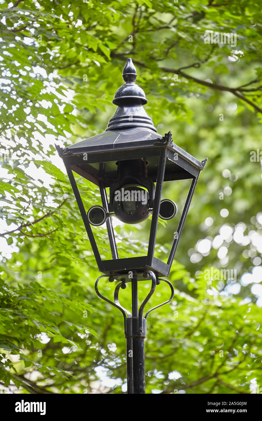 CCTV camera in old lamppost, London, UK Stock Photo