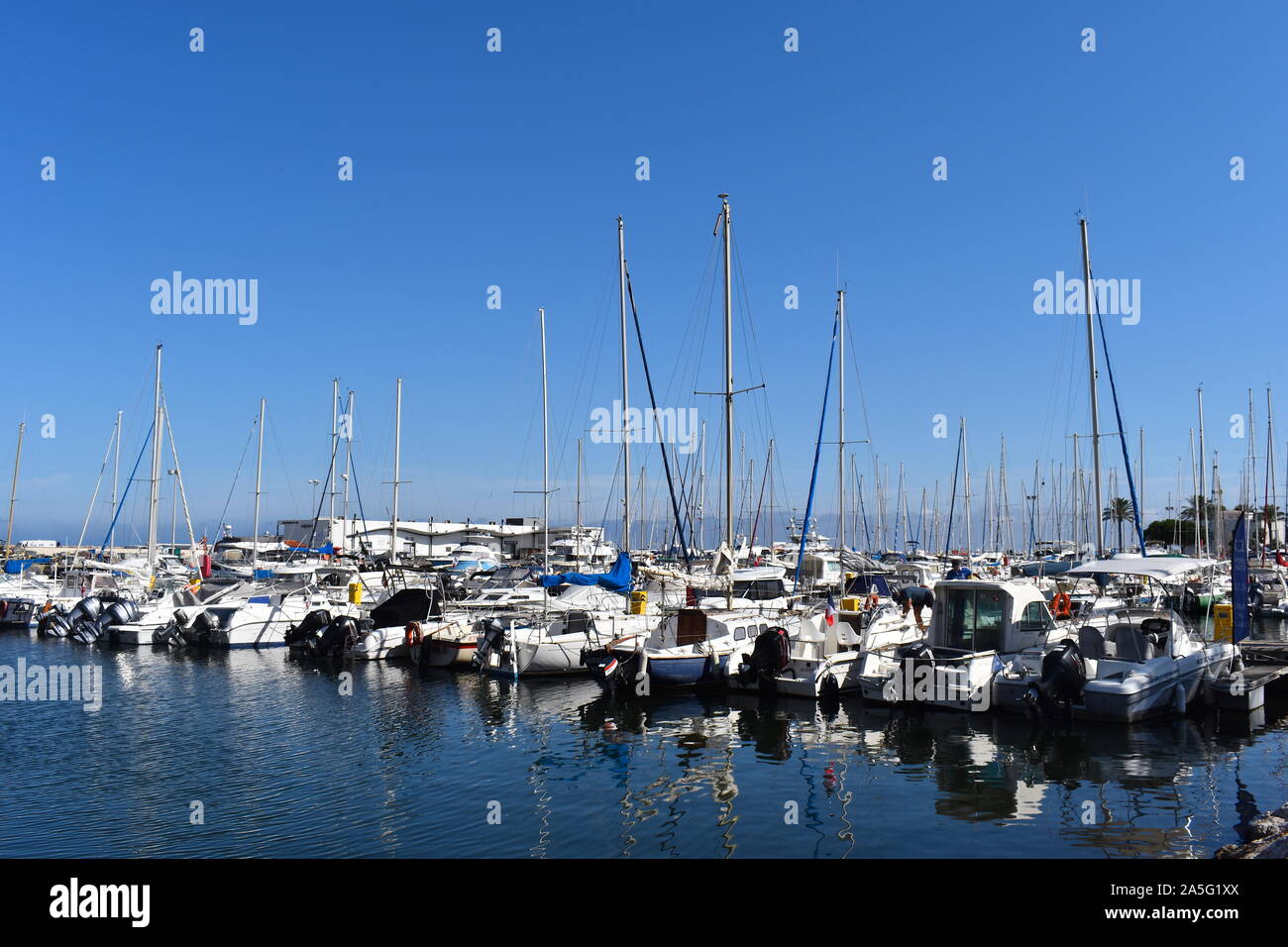 Expensive yachts in the marina in south of France on a  sunny summer day. The posh French Riviera is one of the most popular sailing destinations. Stock Photo