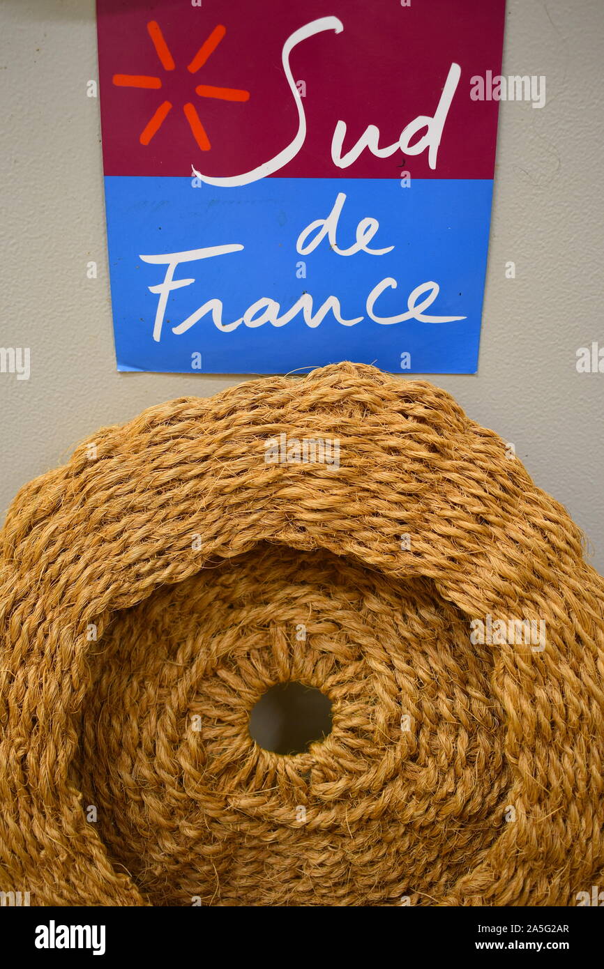 Straw fruit basket typical for southern French coast. Rustic lifestyle amongst European vineyards, forts, castles surrounded by mountains and coast. Stock Photo