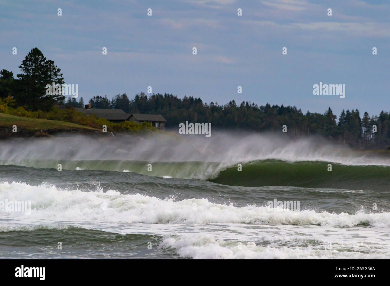 Scarborough, ME, October 10, 2019: heavy swell generated by a noreaster along maine coast creates a plunging barrel Stock Photo