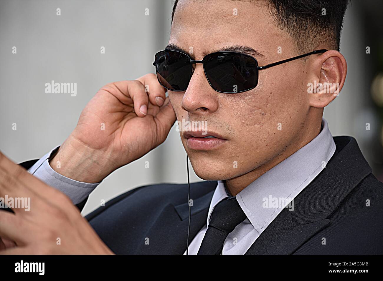 Security Guard Pointing Wearing Sunglasses Stock Photo Alamy