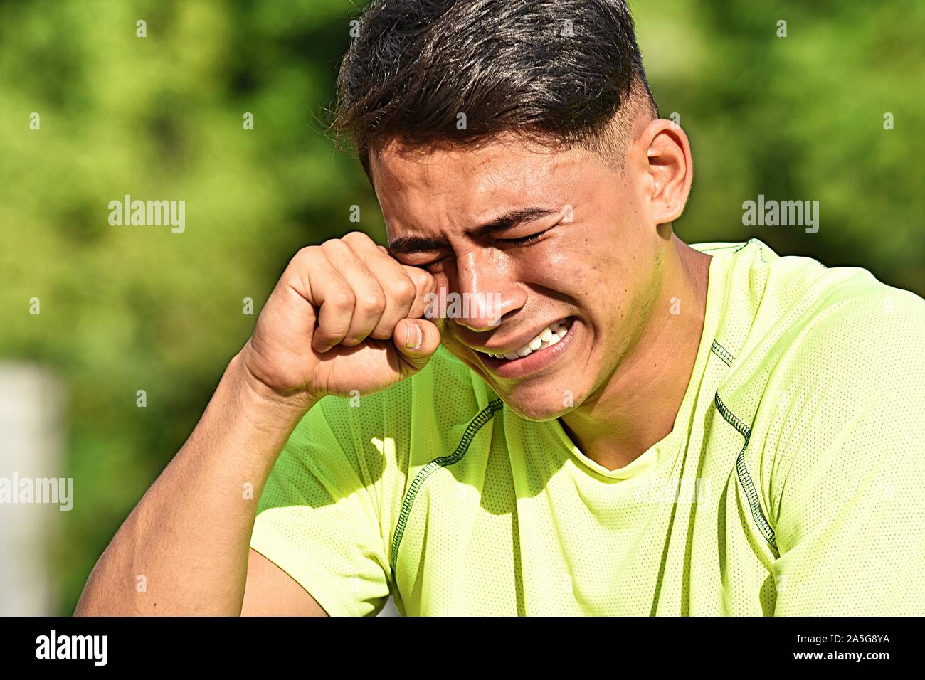 Tearful Fitness Colombian Athletic Man Stock Photo