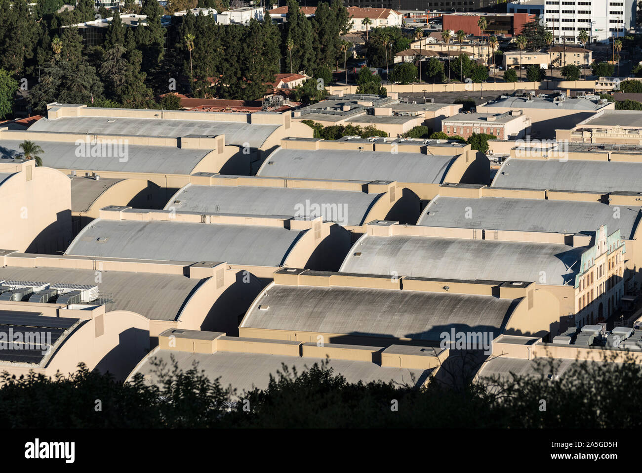 Burbank, California, USA - October 20, 2019:  Morning view of historic sound stages with curved rooftops at the Warner Bros studio lot near Los Angele Stock Photo