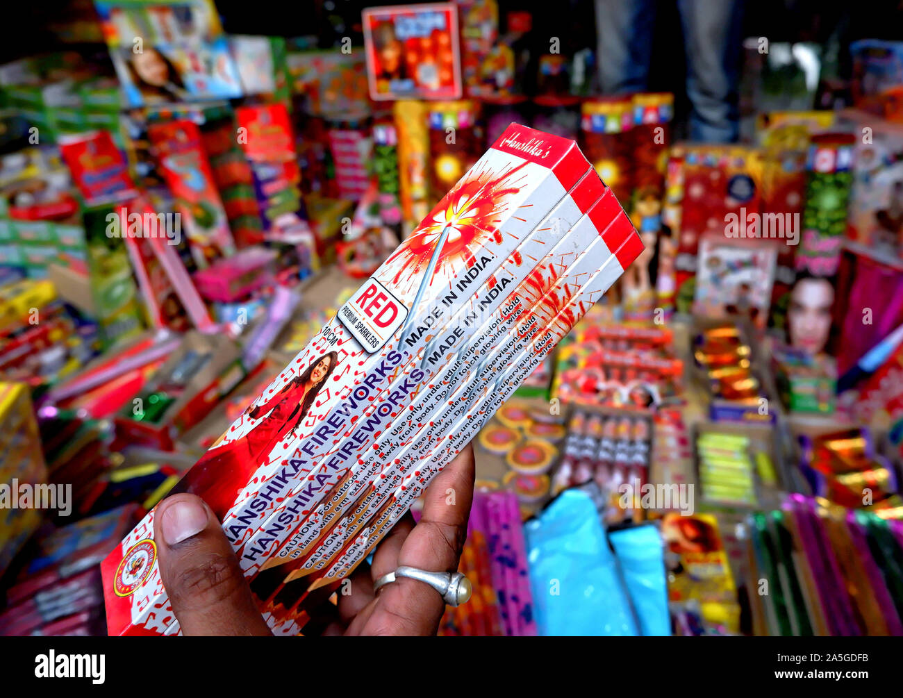 Firecrackers seen on display by a Trader at a Fire works Market at Champahati approx 30 Km from the main city of Kolkata . Firecracker is one of the major item getting sold out for upcoming Diwali Festival . Deepavali or Dipavali is a four-five day-long festival of lights, which is celebrated by Hindus, Jains, Sikhs and some Buddhists in every autumn . Champahati is the Largest Fireworks market in West Bengal, India from where Millions of Fireworks get supplied all over India for celebration. The market produced Turnover (Rs in Million's), 425 million/ year as per Government's Small scale indu Stock Photo