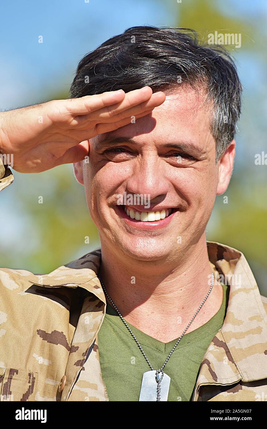Latino Male Soldier Saluting Stock Photo - Alamy