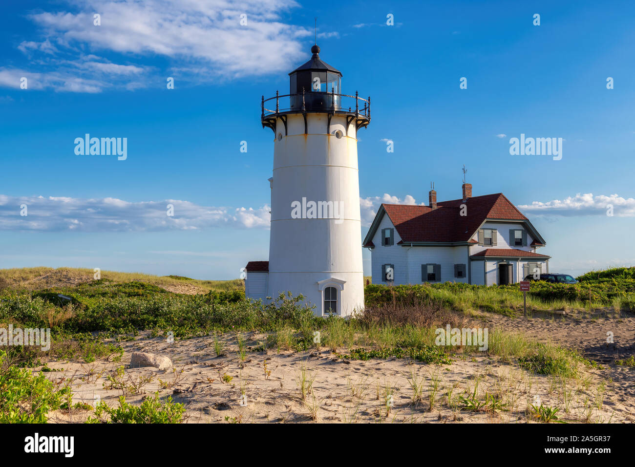Race Point Lighthouse in beach dunes on Cape Cod Stock Photo