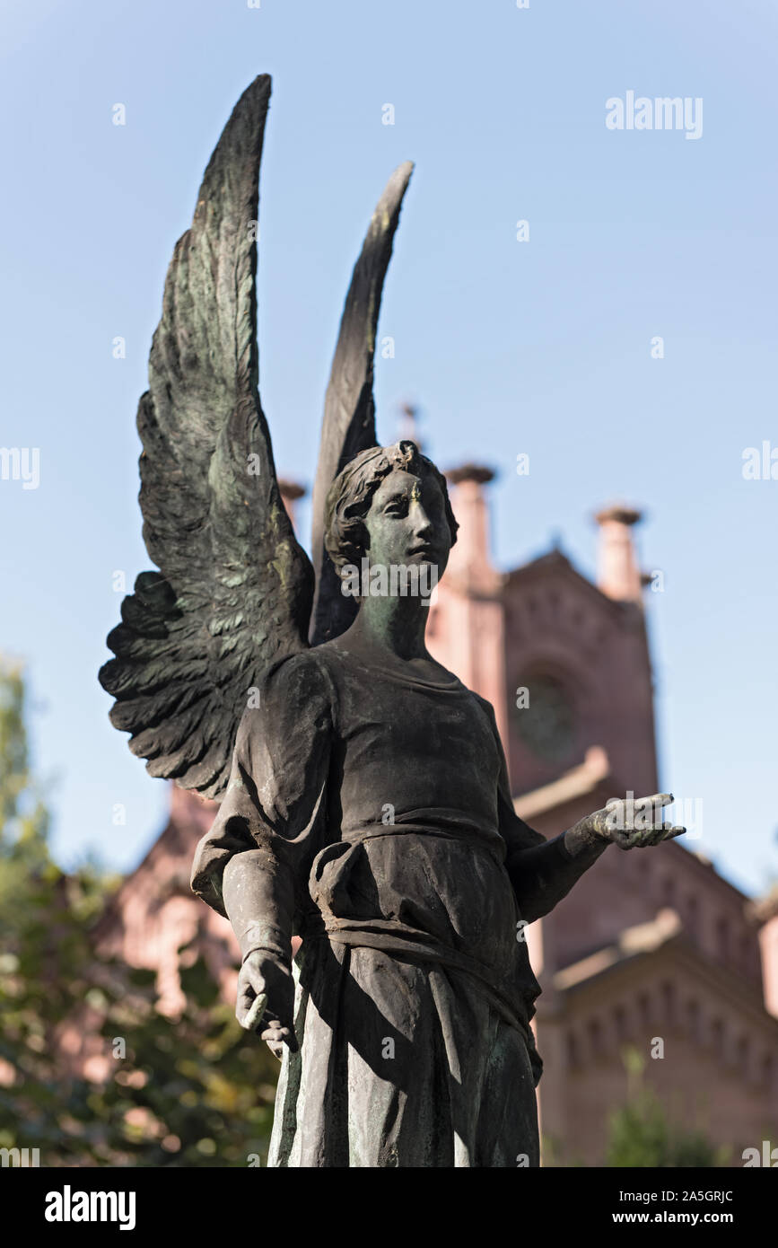 sculpture of the guardian angel at the main cemetery in frankfurt am main, germany Stock Photo