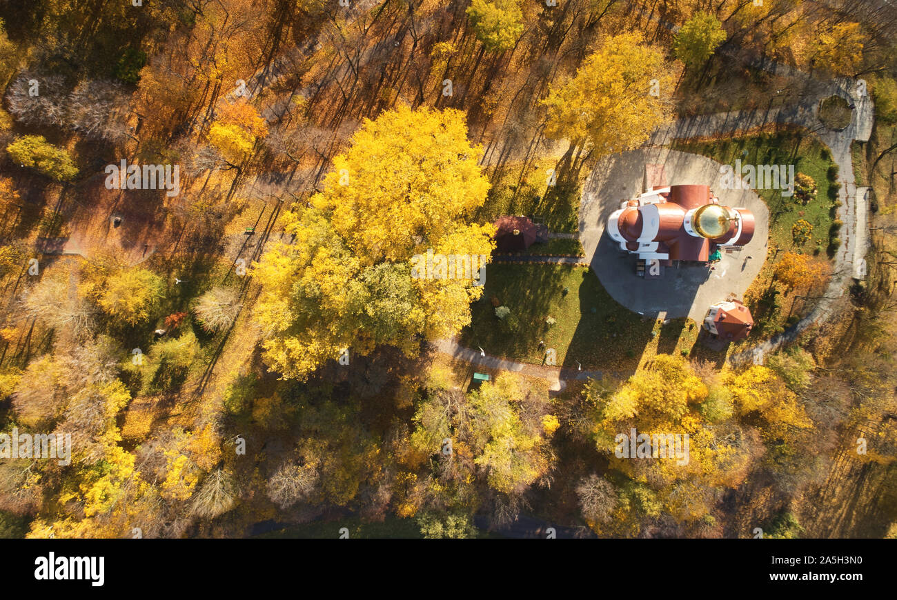 Orthodox church in autumn park aerial above drone view Stock Photo