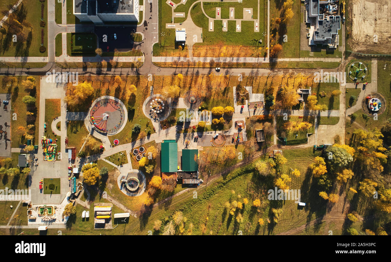 Amusement autumn park above top drone view. Colorful carnival park Stock Photo