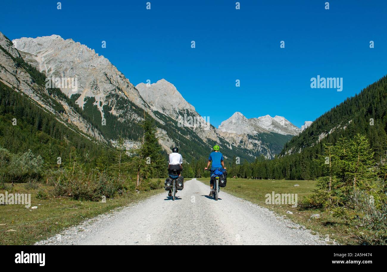Cyclists in the Karwendel valley, way to the Karwendelhaus, Tyrol, Austria Stock Photo