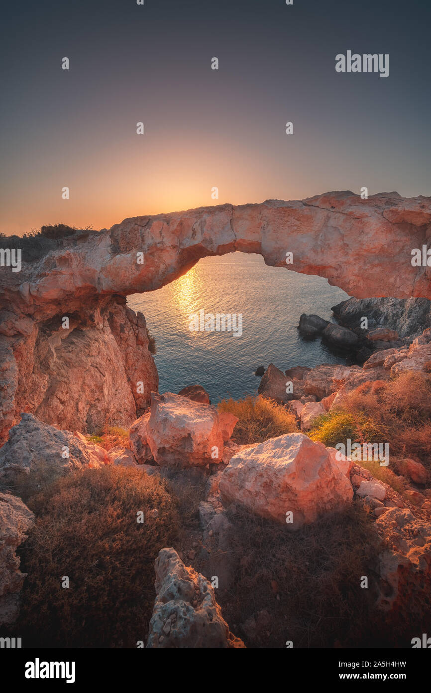 View of Cape Greco and Kamara Tou Koraka natural arch bridge, Protaras, Ayia Napa, Cyprus Stock Photo