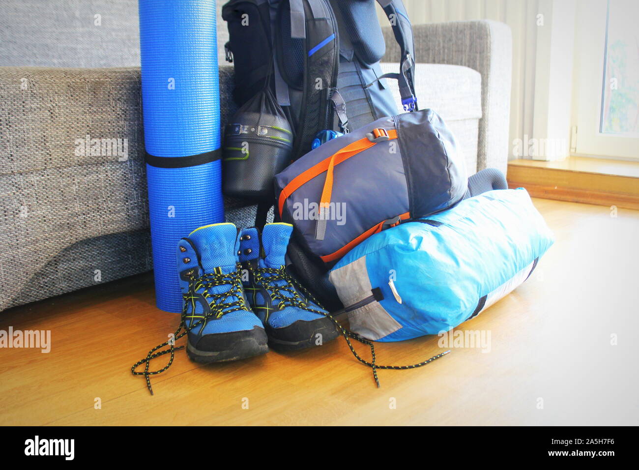 Composition with camping equipment on wooden background Stock Photo