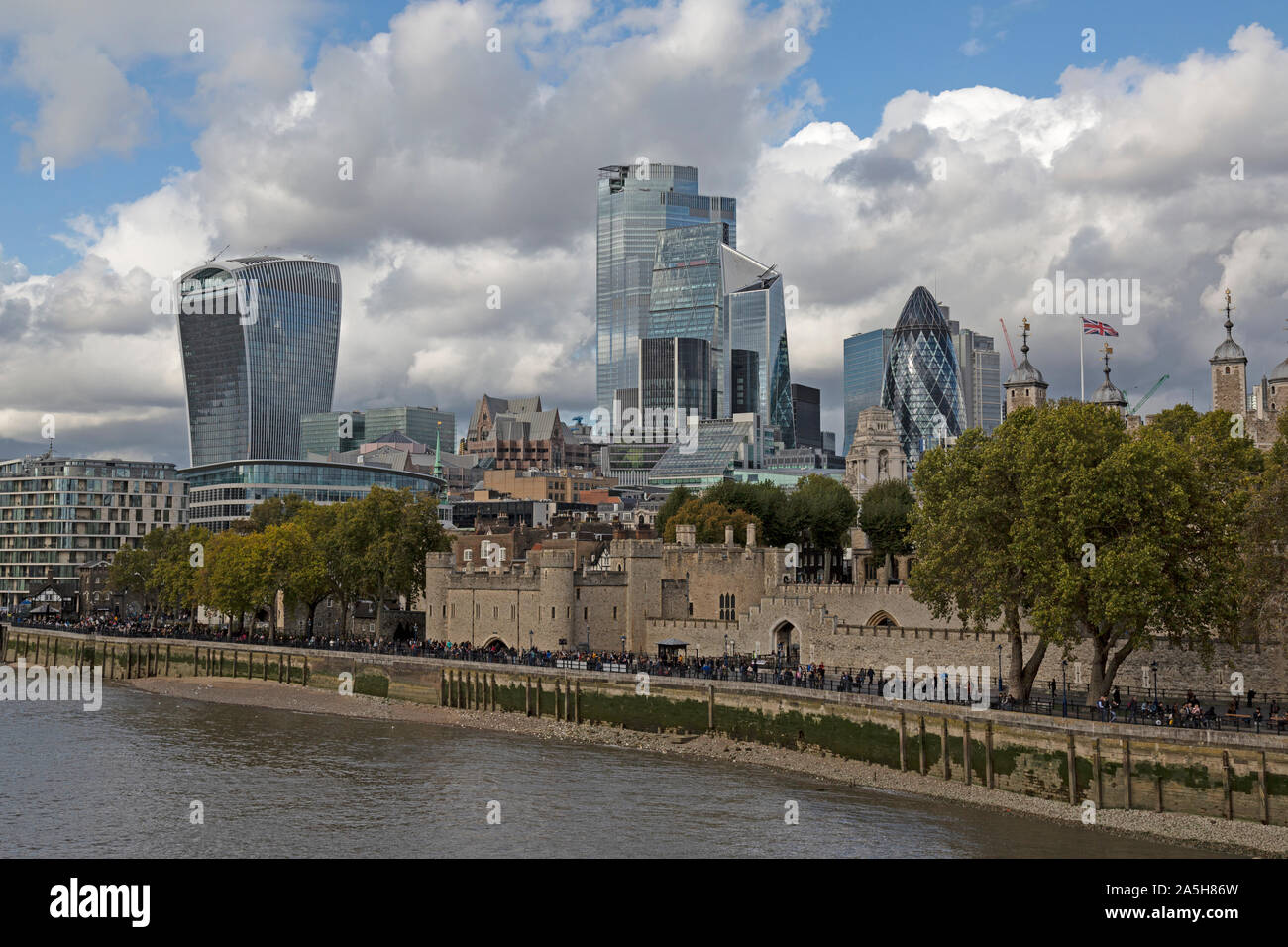 The River Thames in London, with The Tower Of London and the walkie talkie Commercial Building at 20 Fenchurch Street in the background. Stock Photo