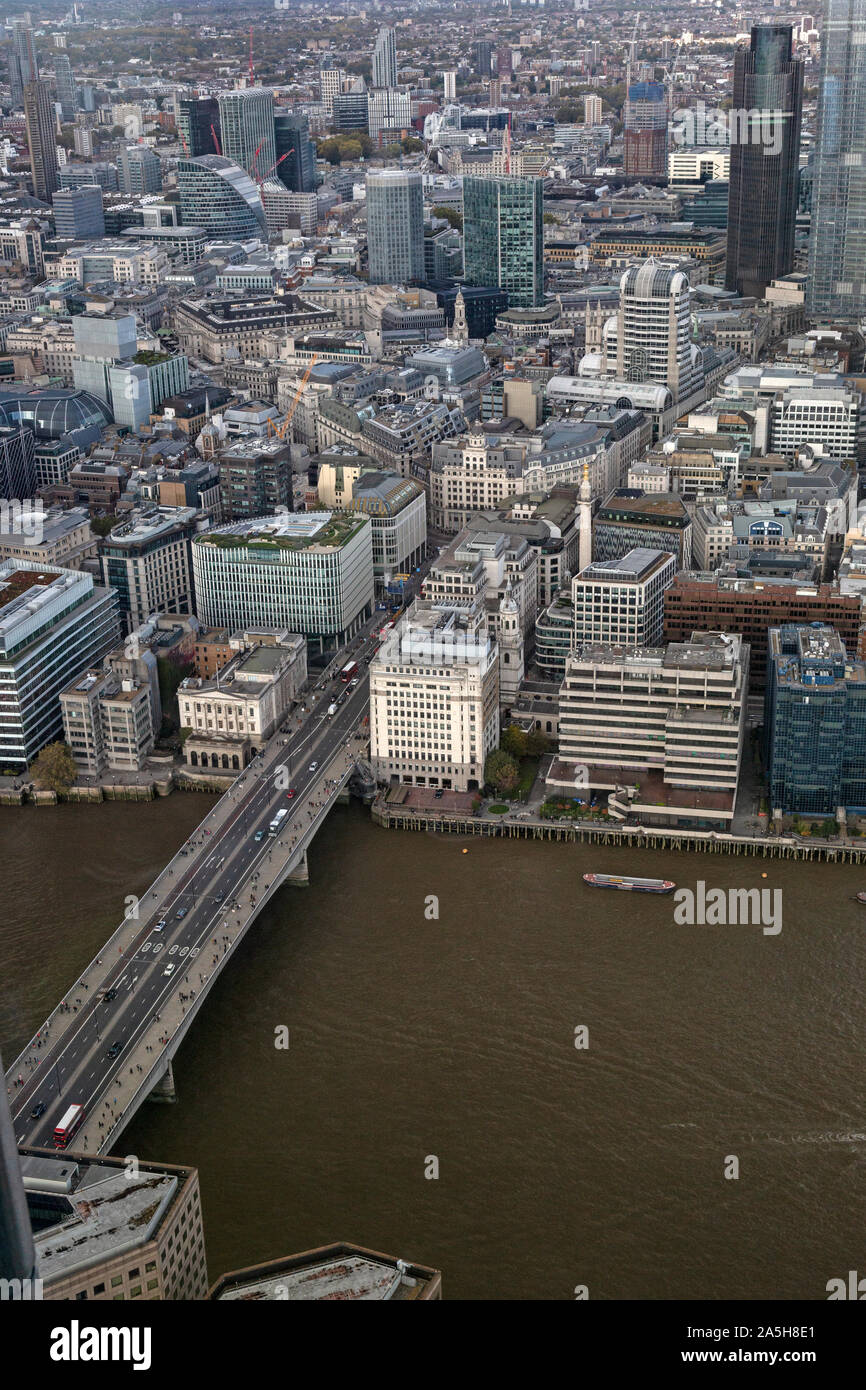 An aerial view looking north over London Bridge across the River Thames in London. Stock Photo