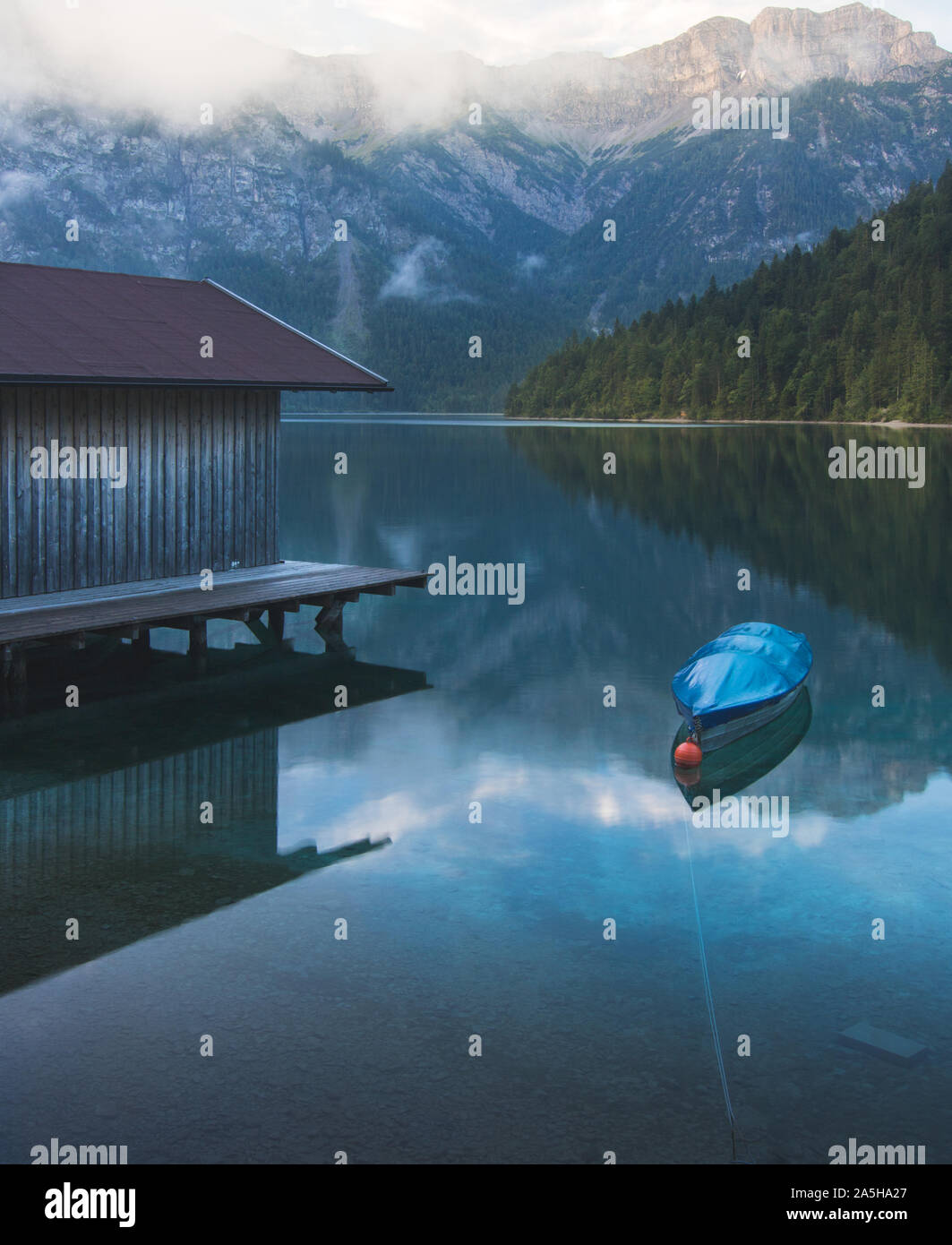 Lake side at Plansee in Austria with mountains Stock Photo - Alamy
