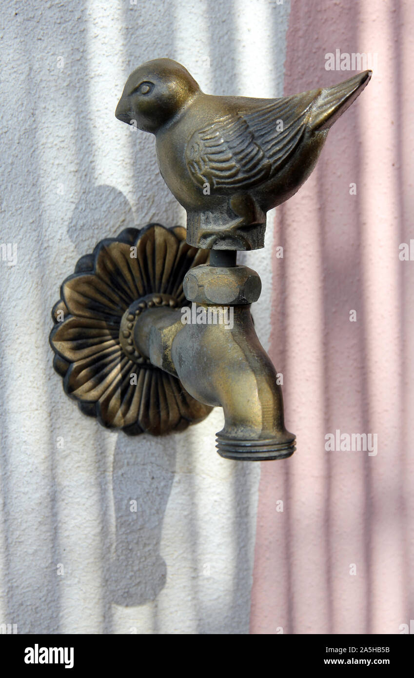 brass ornamental bird tap Italy Stock Photo