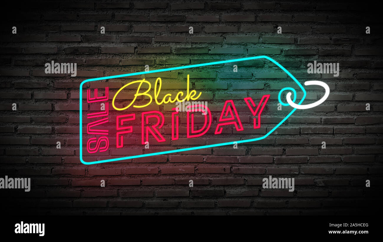 Black Friday label sale tag shiny neon lamps sign glow on black brick wall. colorful sign board for Black Friday sale promotion and advertising Stock Photo