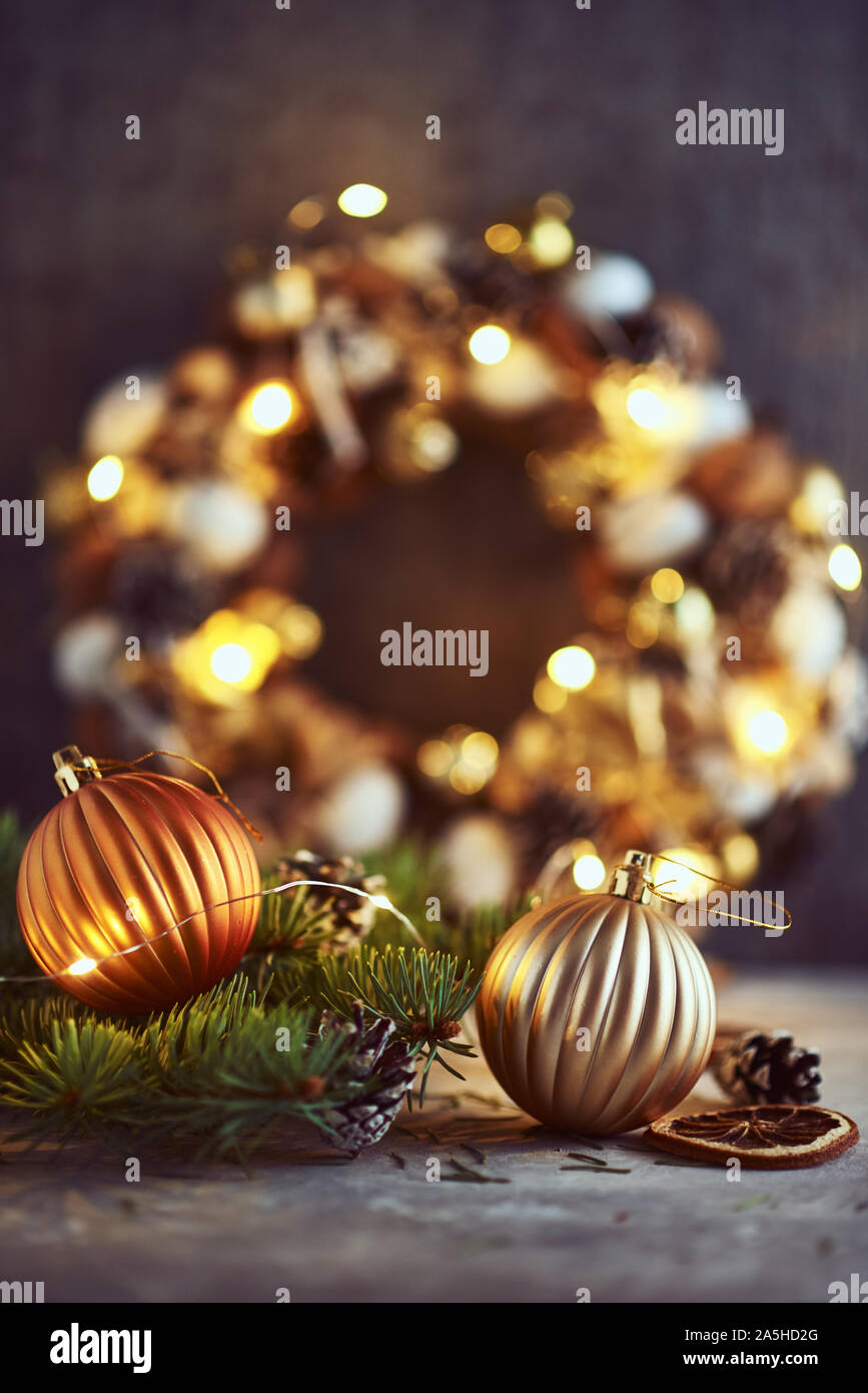 Christmas decorations with golden balls, fir tree branch and garland ...