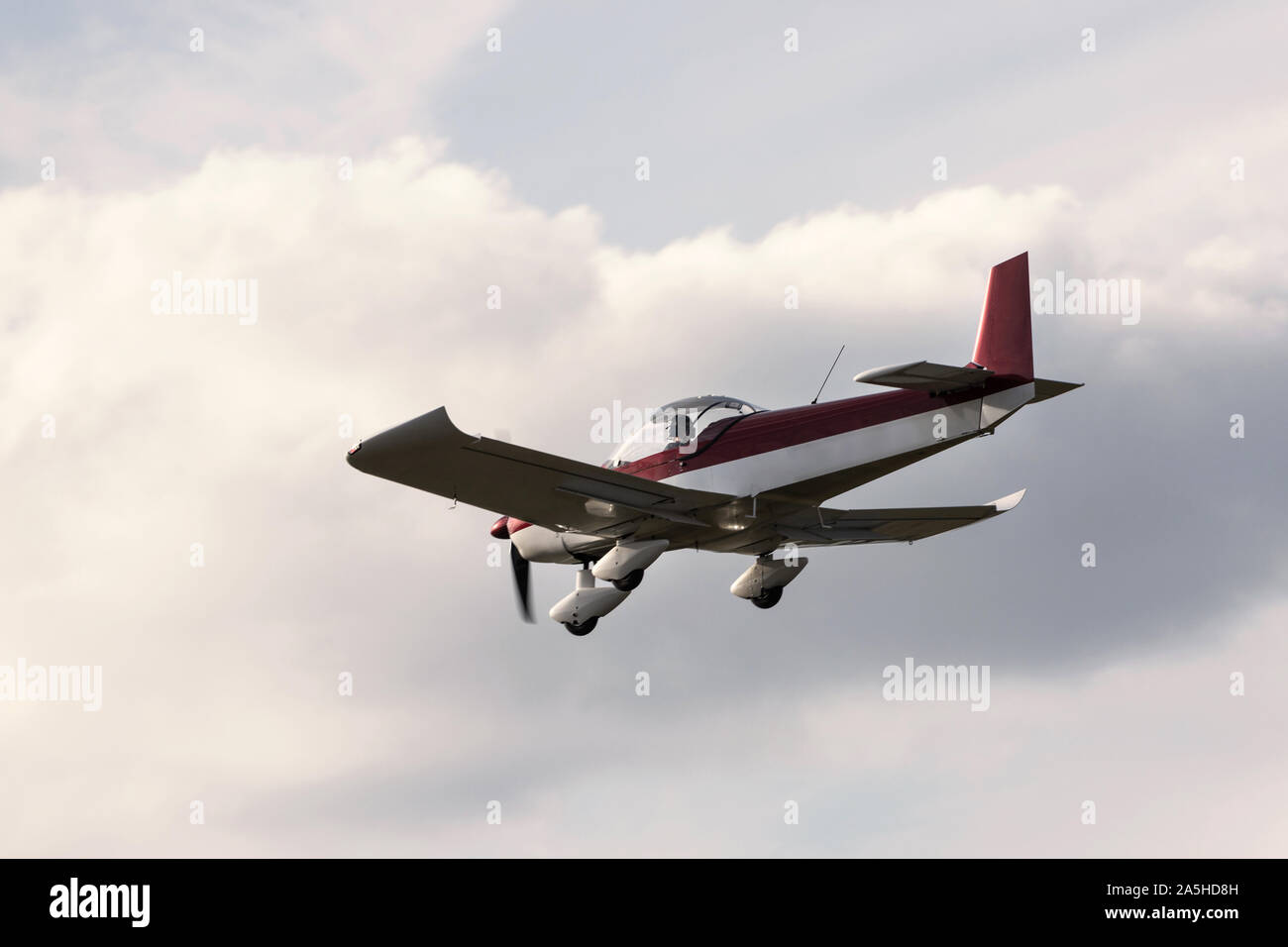 sports aiplane flying mid air Stock Photo
