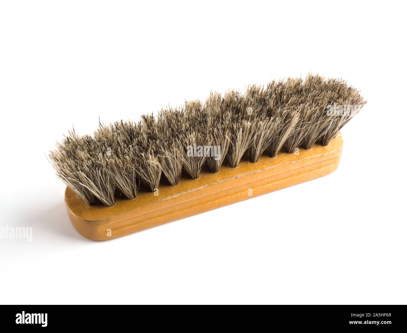 Clothes brush on a white background, hair up Stock Photo