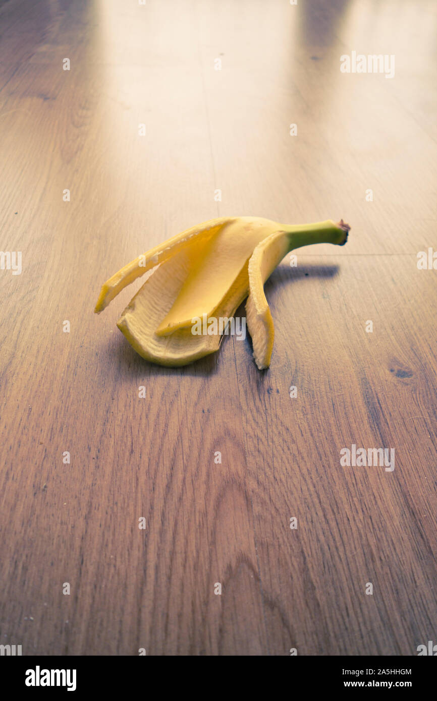 banana peel discarded on the floor Stock Photo