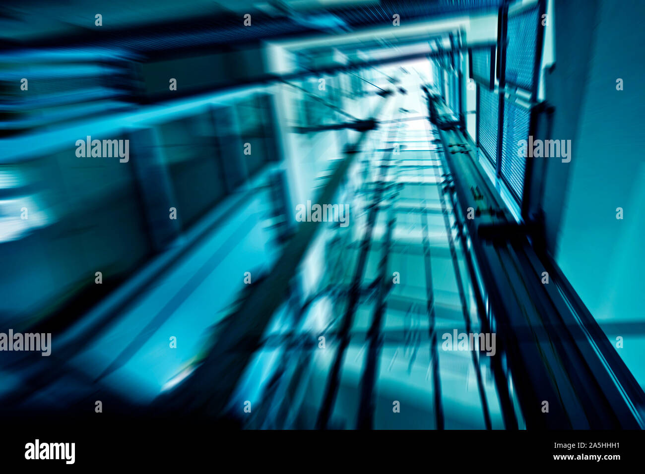 escalator shaft with motion blur effect Stock Photo