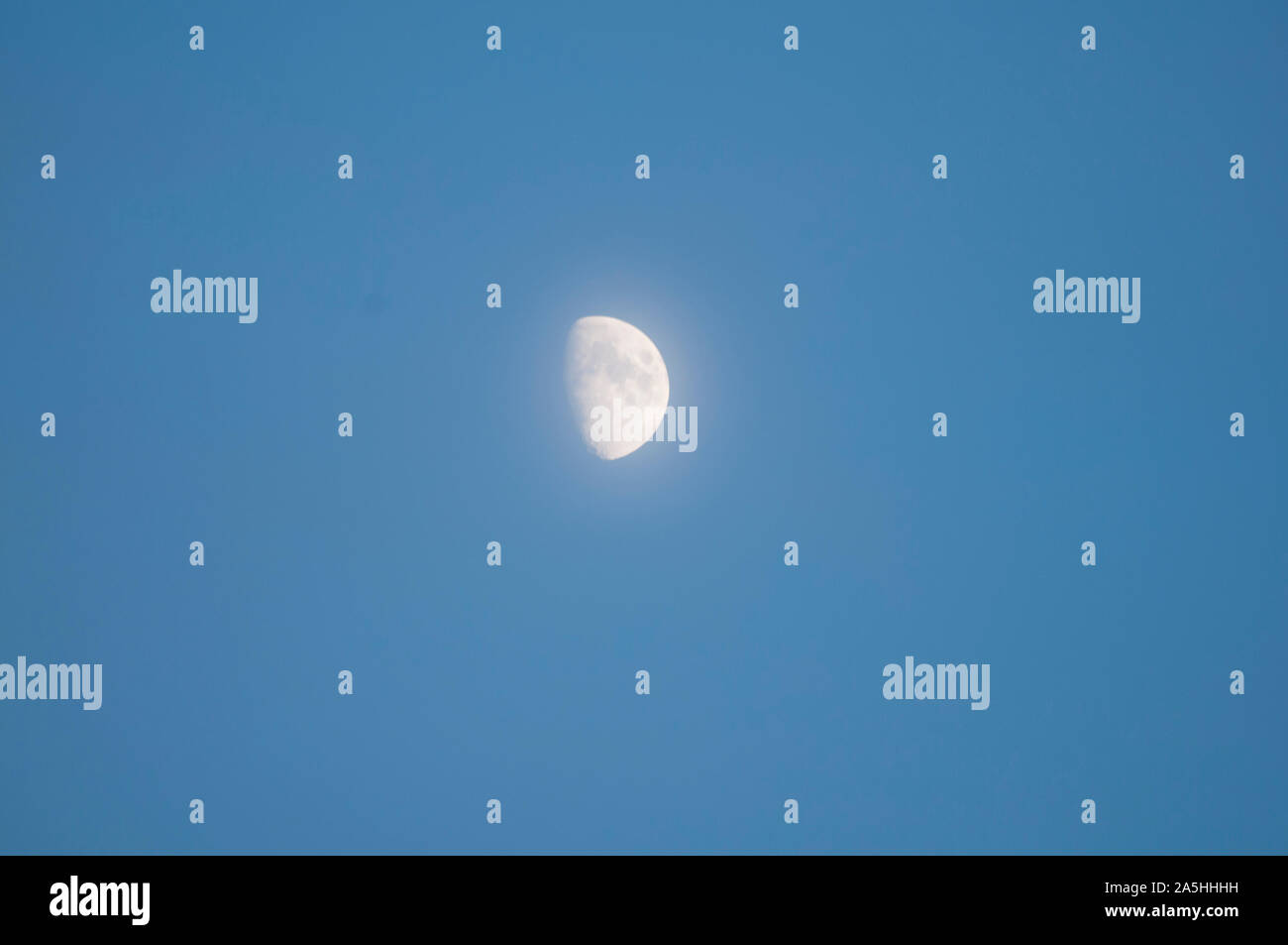 glowing first quarter moon phase Stock Photo