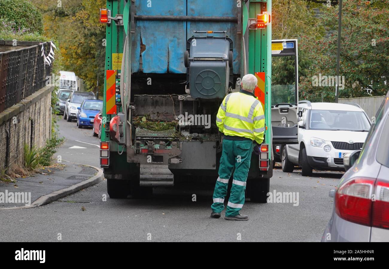 Council workers empty bins in New Mills Stock Photo Alamy