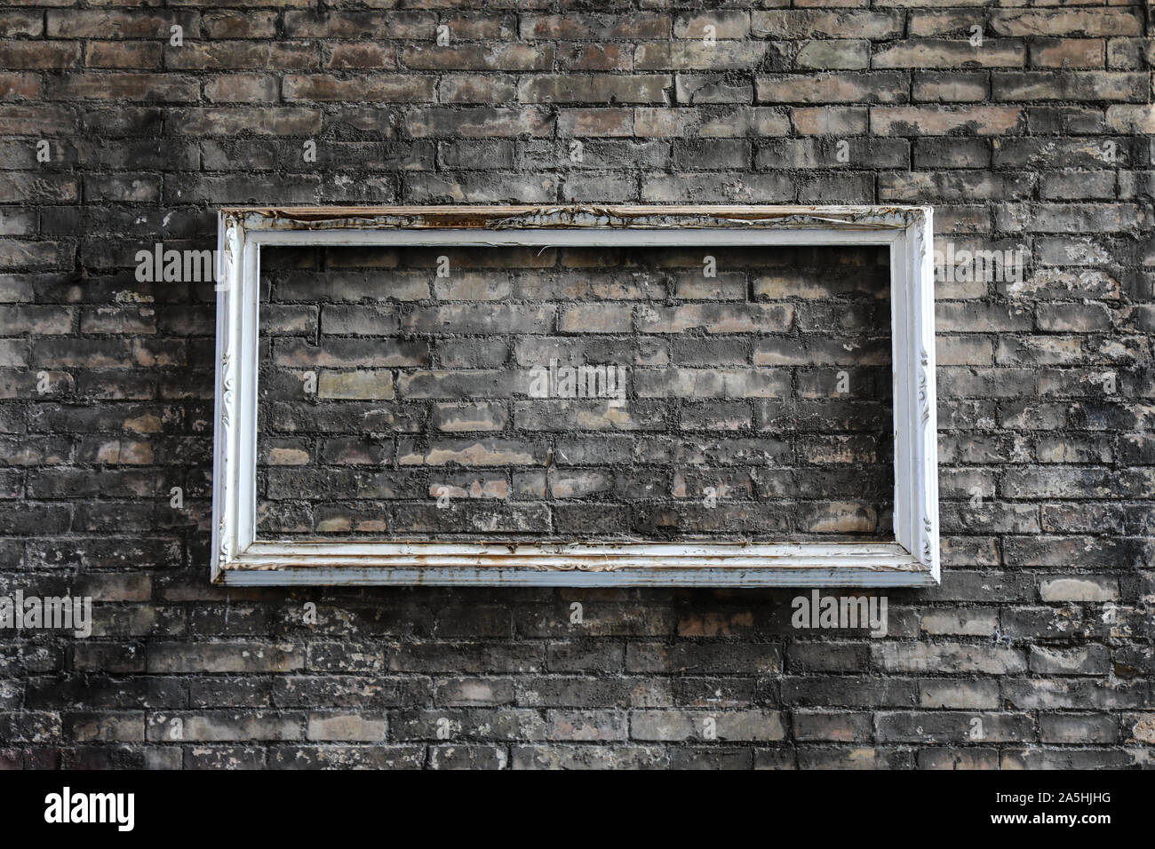 Empty frame on brick wall in Trastevere, Rome Stock Photo
