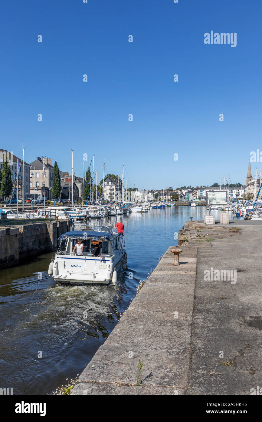 A motor boat enters the mooring basin on the Vilaine river at Redon Stock Photo