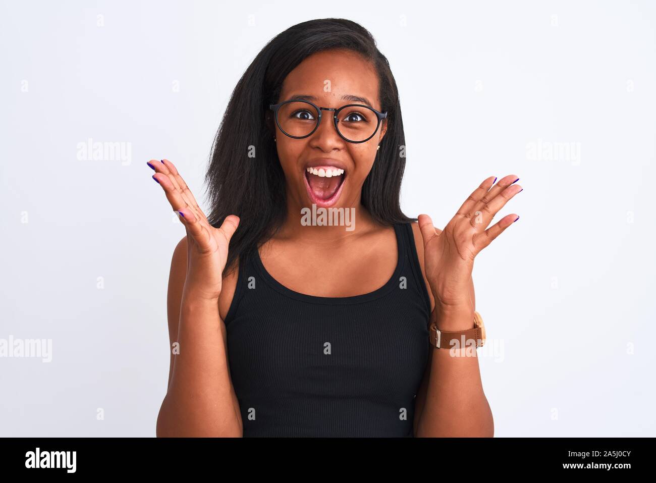 Beautiful young african american woman wearing glasses over isolated ...