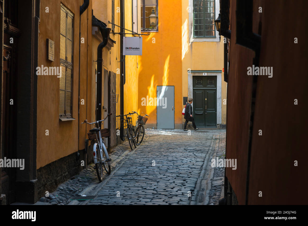 Sweden color Stockholm, view of a typical cobbled street in the historic Old Town (Gamla Stan) area of Stockholm city center, Sweden Stock Photo