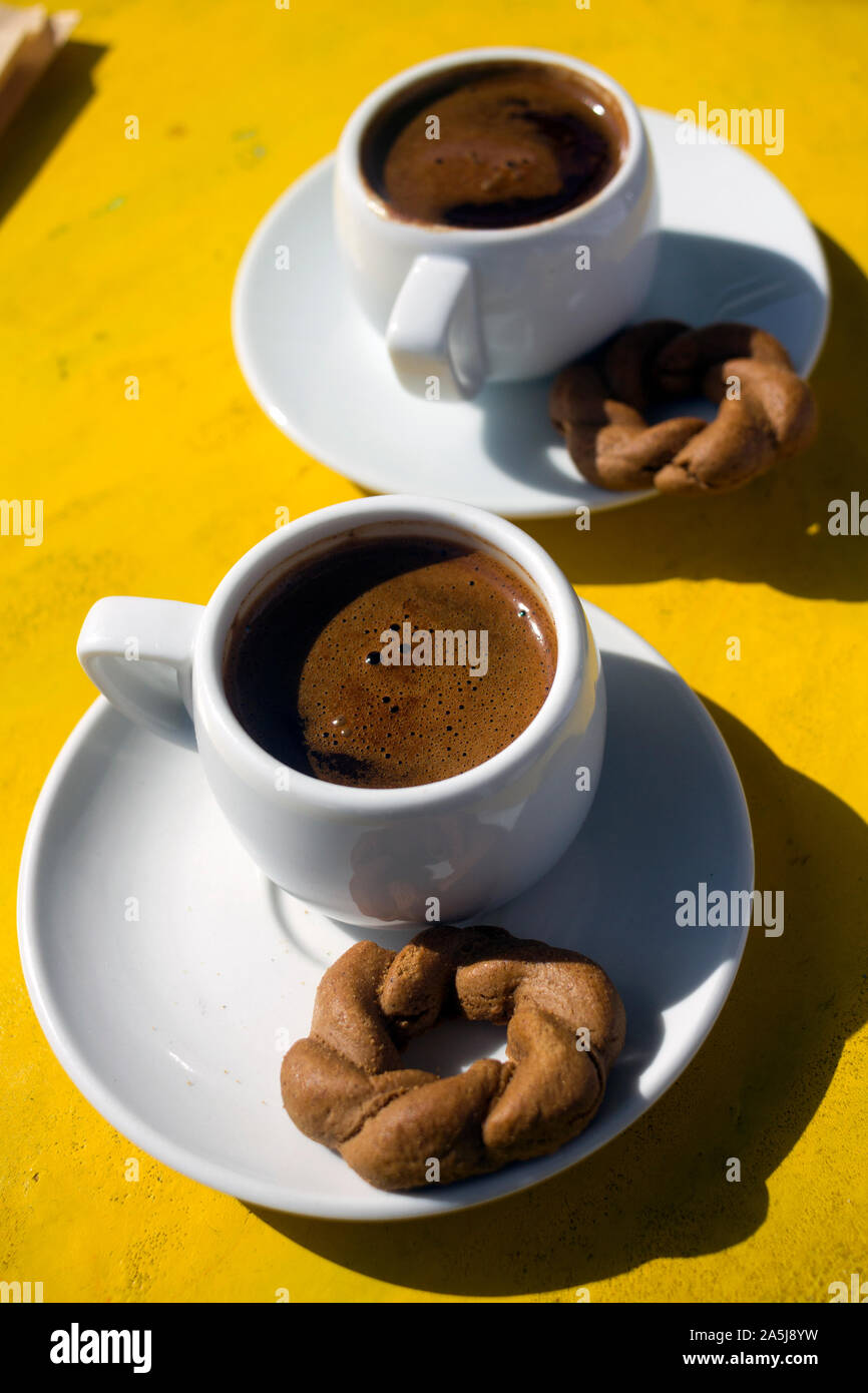 https://c8.alamy.com/comp/2A5J8YW/a-cups-of-traditional-greek-coffee-with-cookie-served-in-all-over-the-greece-2A5J8YW.jpg