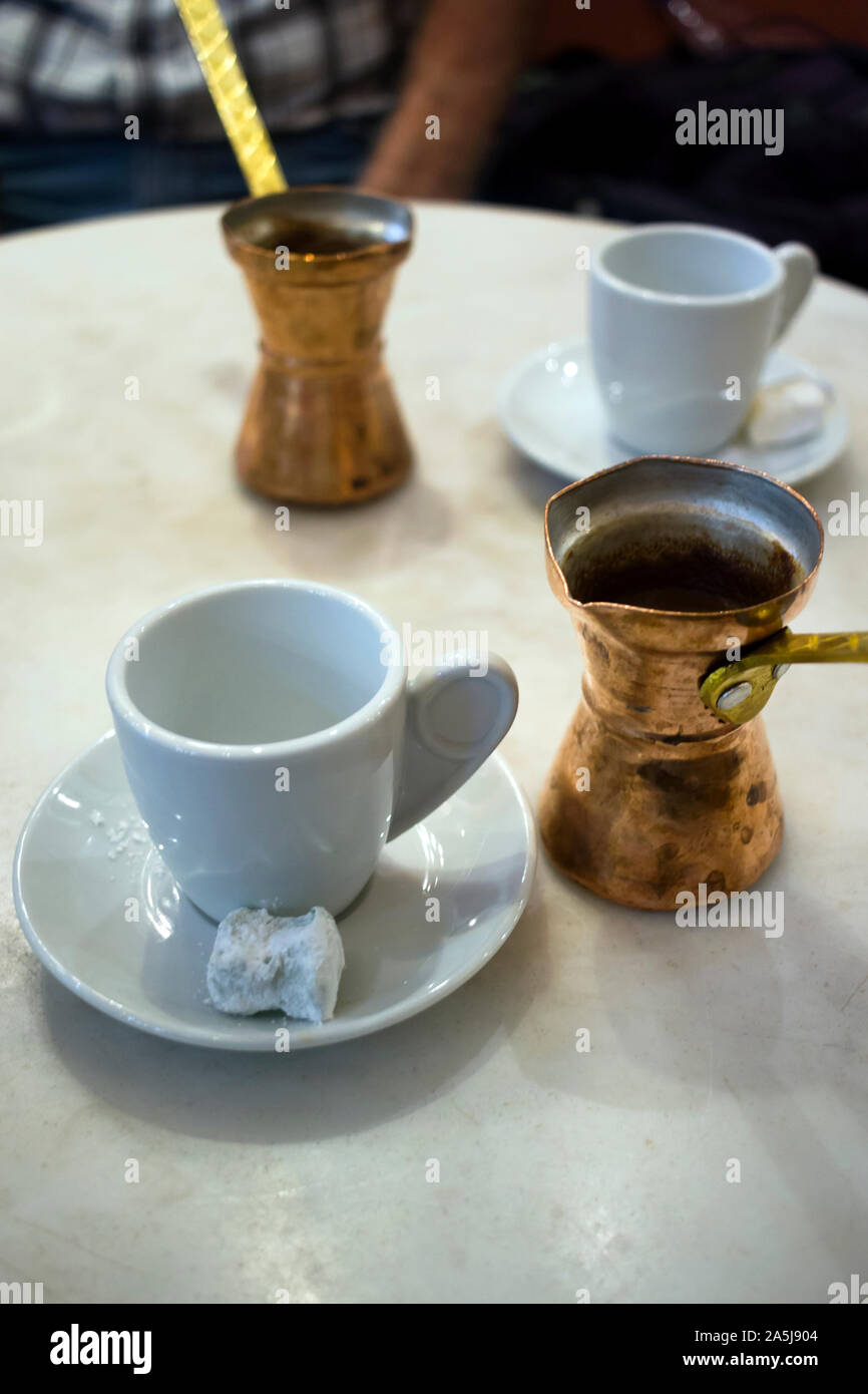 Greek coffee served with traditional greek coffee pots (Briki) and