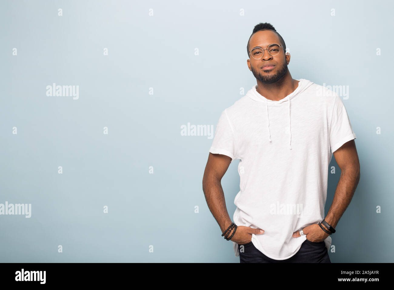 African American man in glasses posing in studio Stock Photo