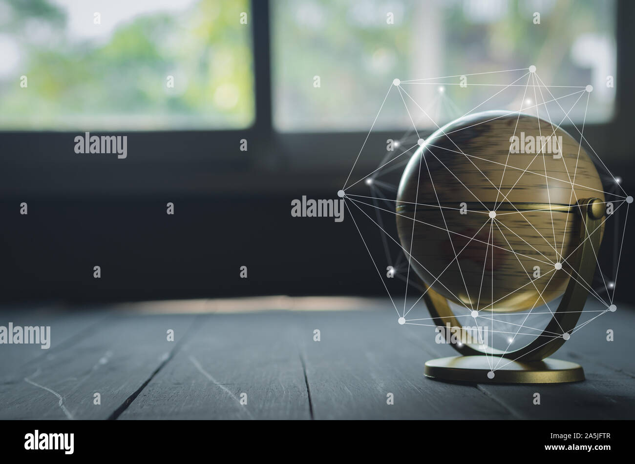 spinning globe on black table with hand drawing grid line Stock Photo