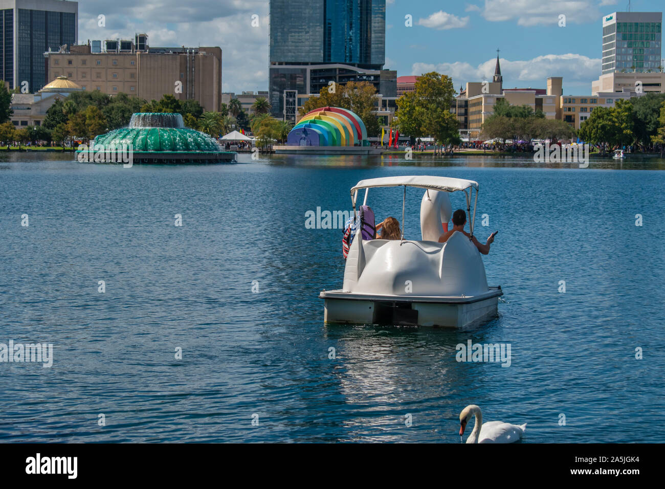 Orlando, Florida. October 12, 2019. Swan boats and swan at Lake Eola