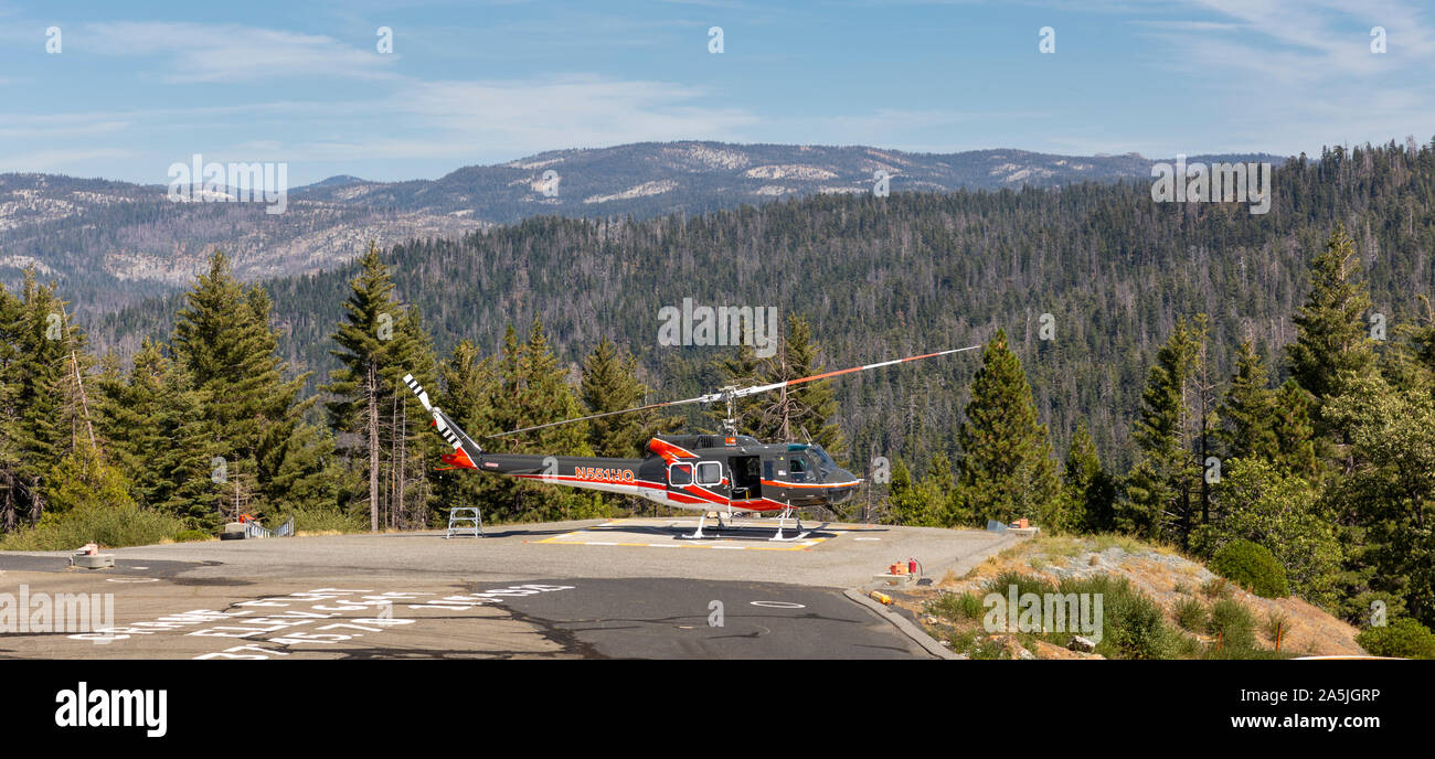 YOSEMITE NATIONAL PARK, USA - SEPTEMBER 13, 2019 : Resuce helicopter on the helipad at the Crane Flat fire lookout in Yosemite Park, California. Stock Photo