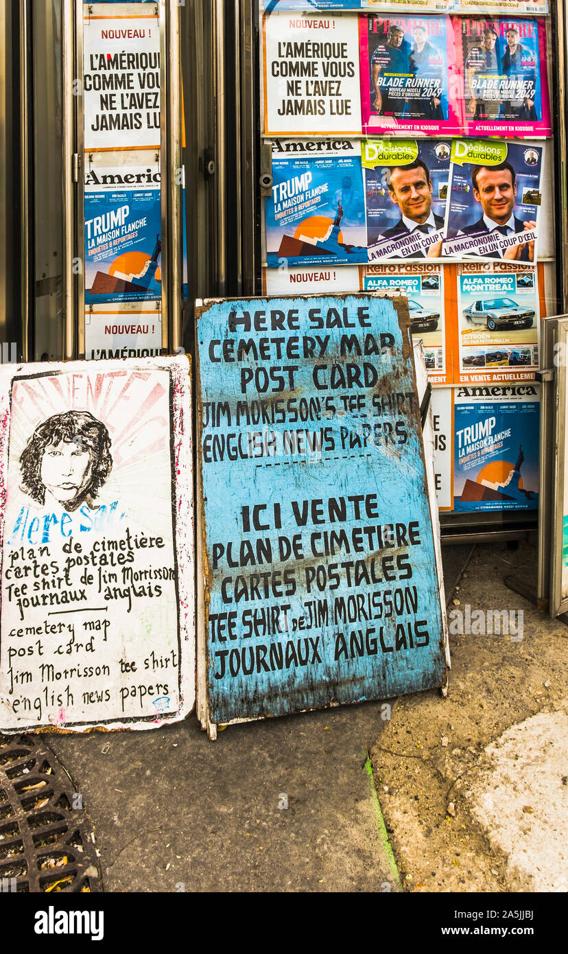 newsstand with posters advertising maps of pere lachaise cemetery Stock Photo