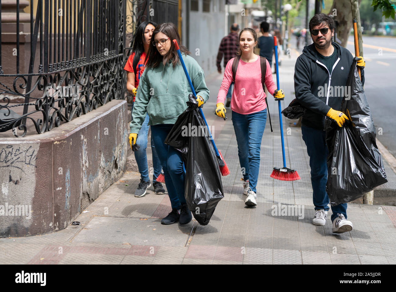 people cleaning the streets