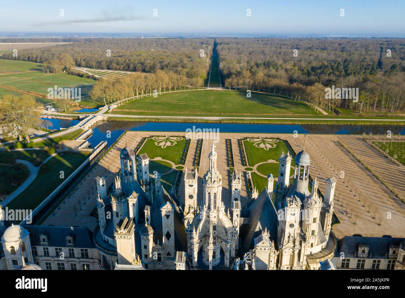 France, Loir et Cher, Loire Valley listed as World Heritage by UNESCO, Chambord, royal castle, overhead view on the roofs, French gardens bordered by Stock Photo