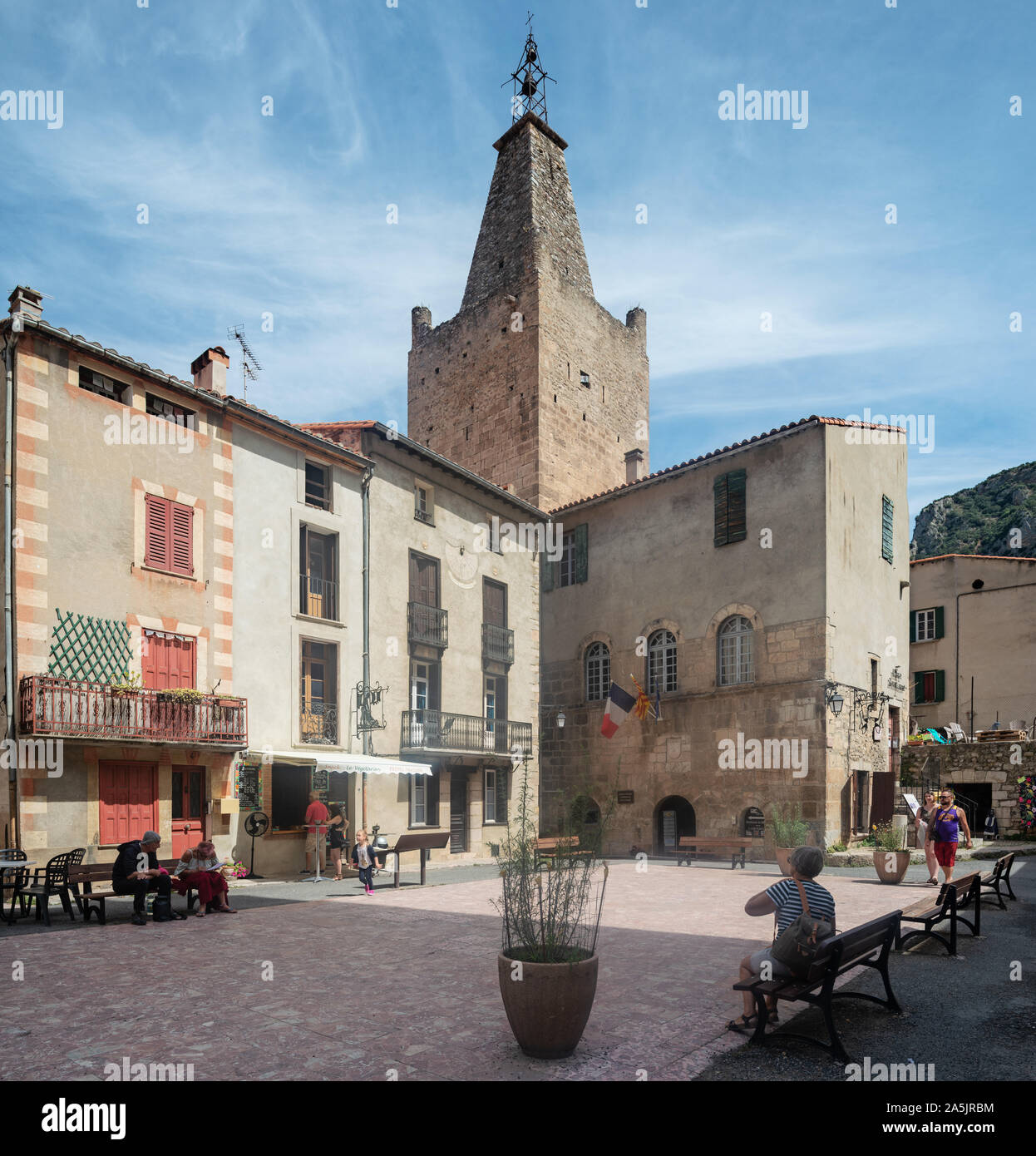 People walking in old streets of Villefranche-De-Conflent town, Pyrenees Orientales, French Catalonia, France Stock Photo