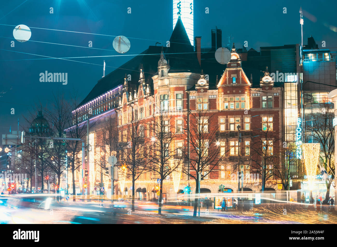 Helsinki, Finland - December 8, 2016: Building On The Corner Of Pohjoisesplanadi Street And Mannerheimintie Or Mannerheim Avenue In Evening Night Illu Stock Photo