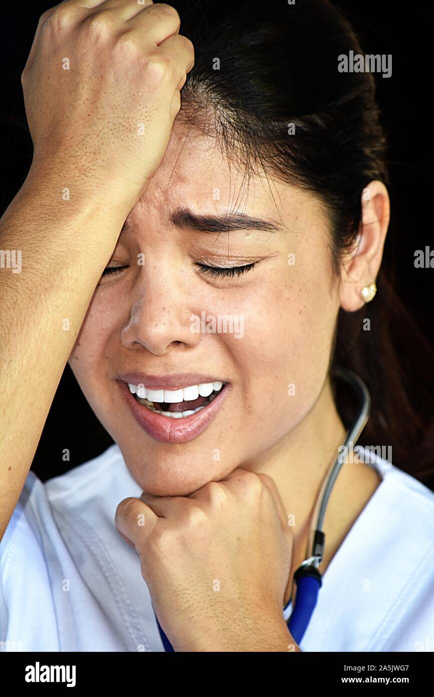 Female nurse wearing scrubs hi-res stock photography and images - Alamy