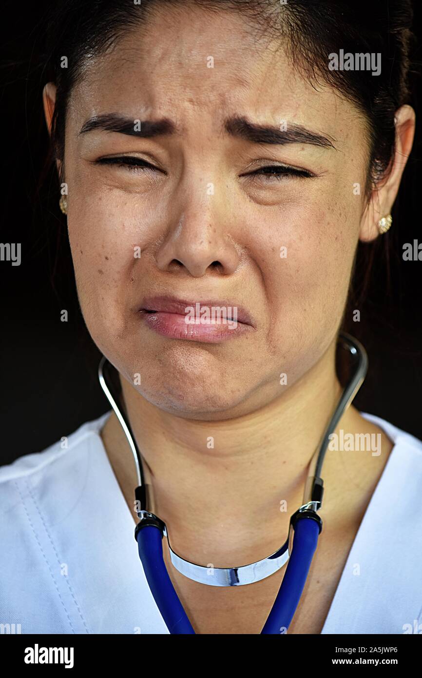 Crying Minority Medical Professional Wearing Scrubs Stock Photo Alamy
